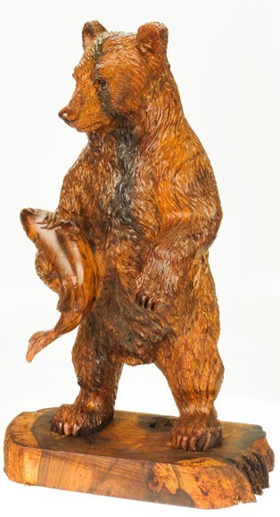 View Grizzly Bear standing with fish