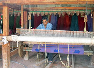zapotec artist working on a bench